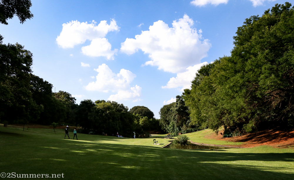 An expansive green lawn in the Wilds