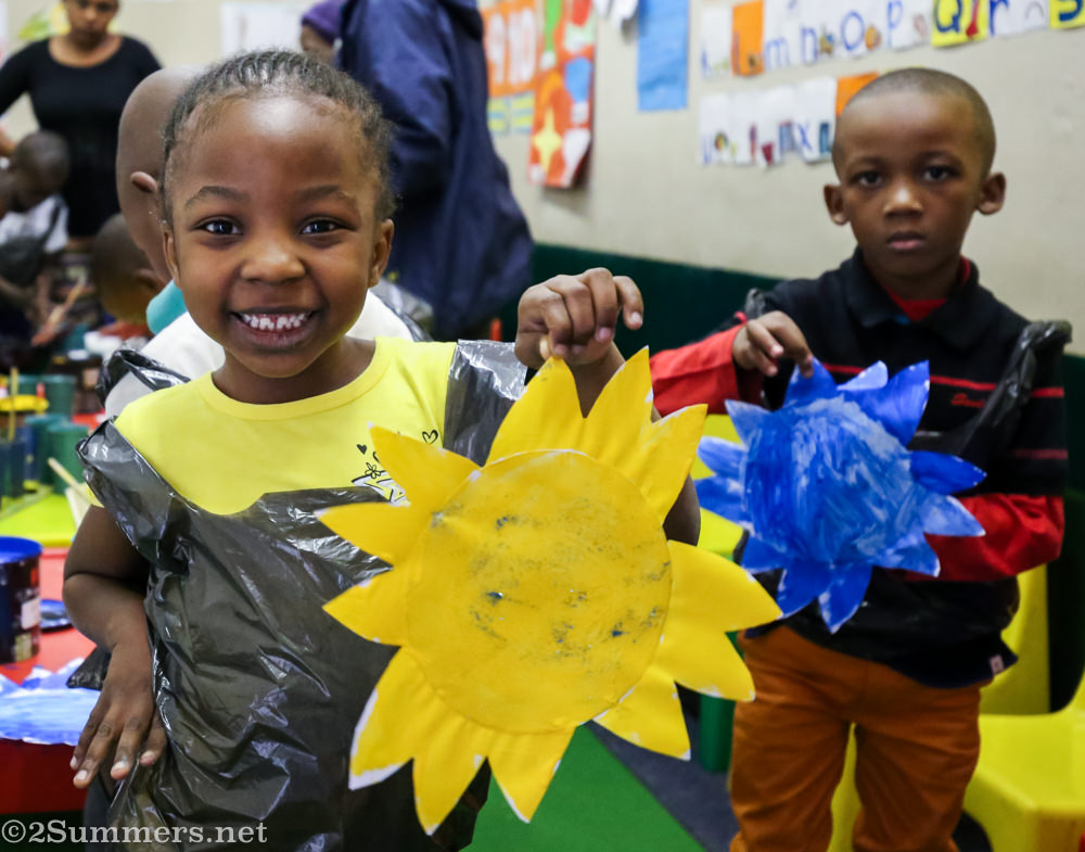 A happy girl with a happy completed flower