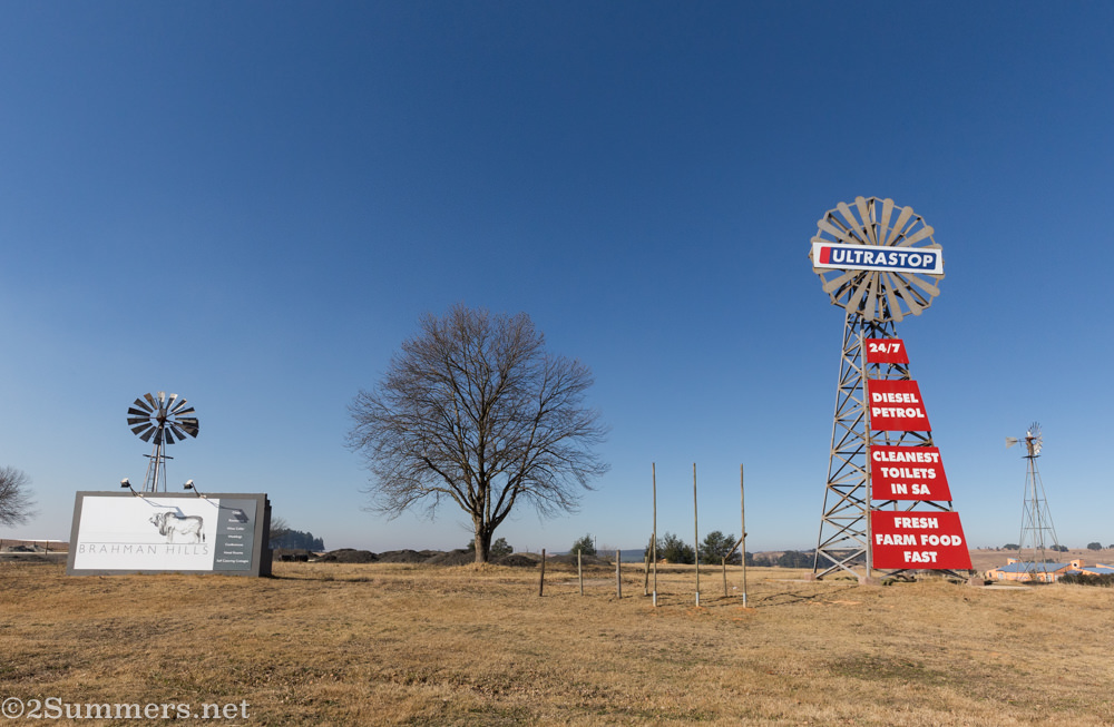 Windmills and Brahman Hills signs