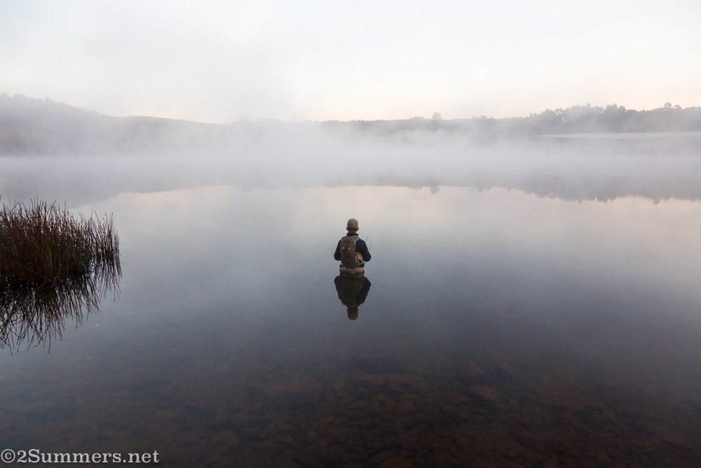 Flyfisherman and perfect reflection on Stanford Lake