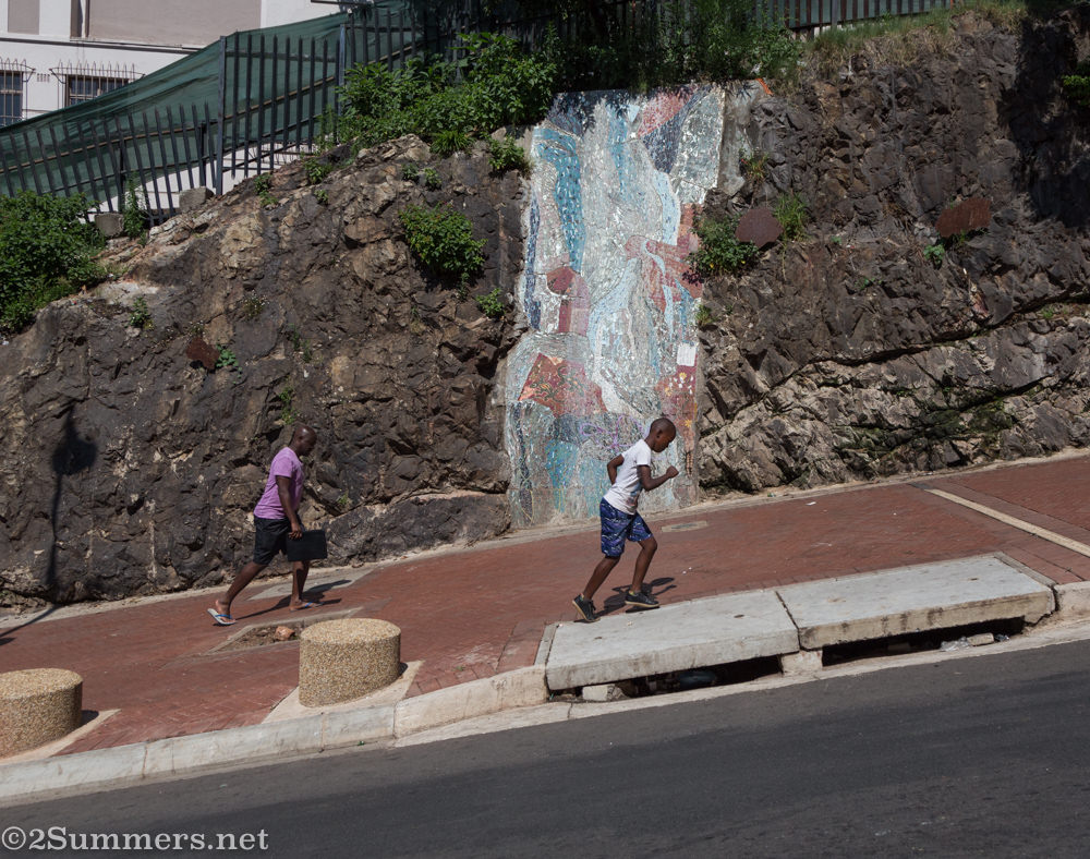 Kids running up Nugget Hill in Hillbrow