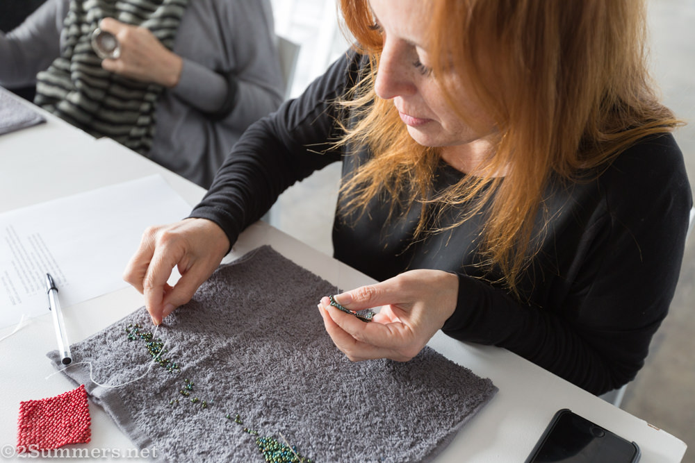 Laurice picks up her beads