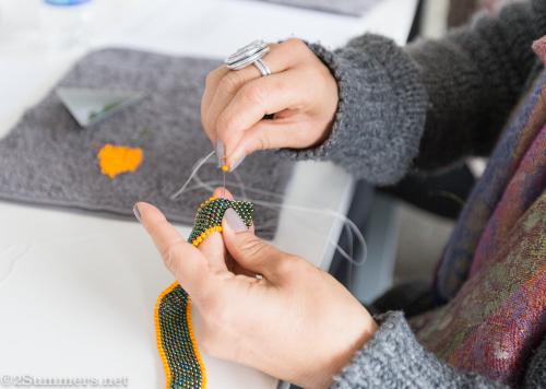 Green and orange beading at piece