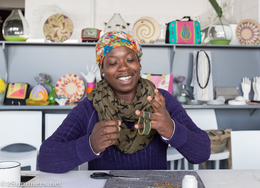 Thabo finishing my bracelet