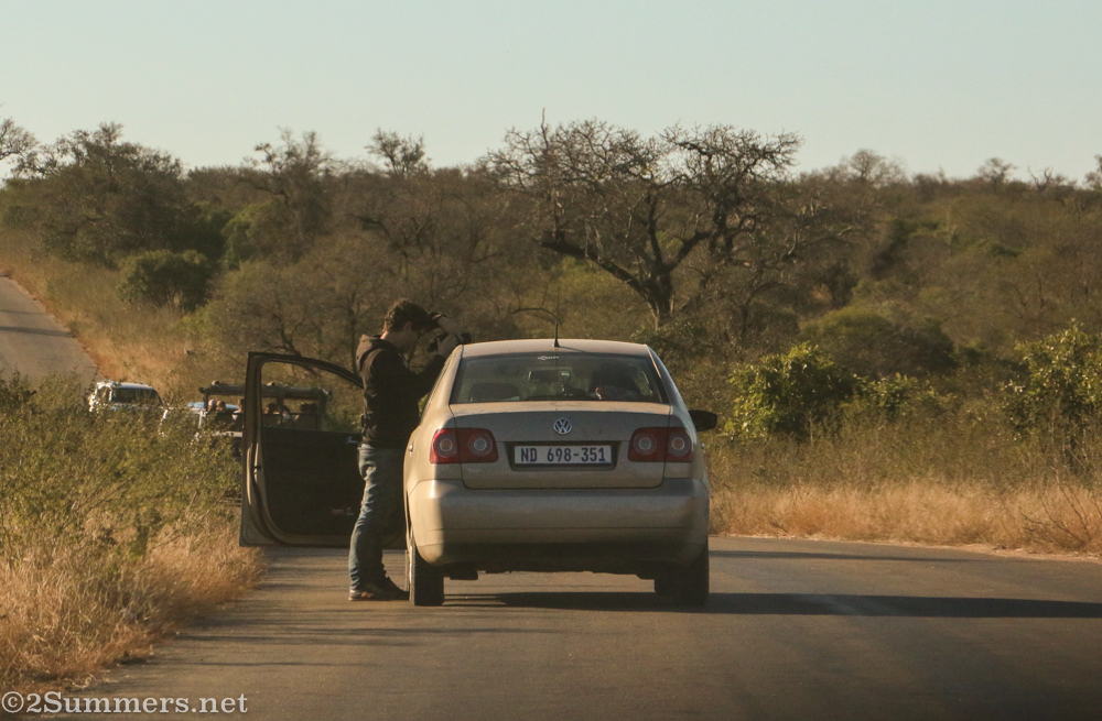 Guy outside his car in the Kruger