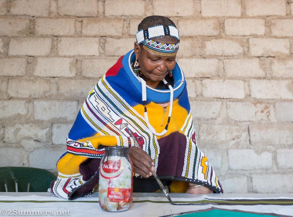 Mama Sophie painting an Ndebele mural