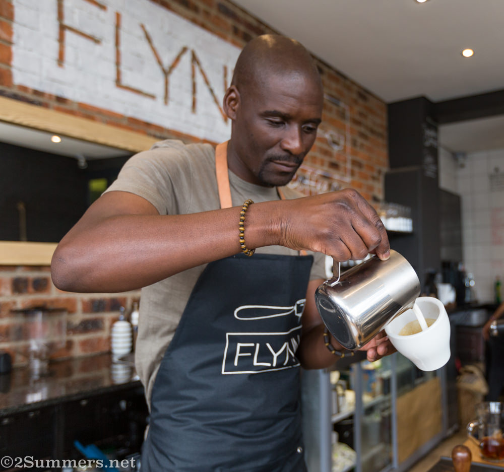 Sipho making a cappuccino