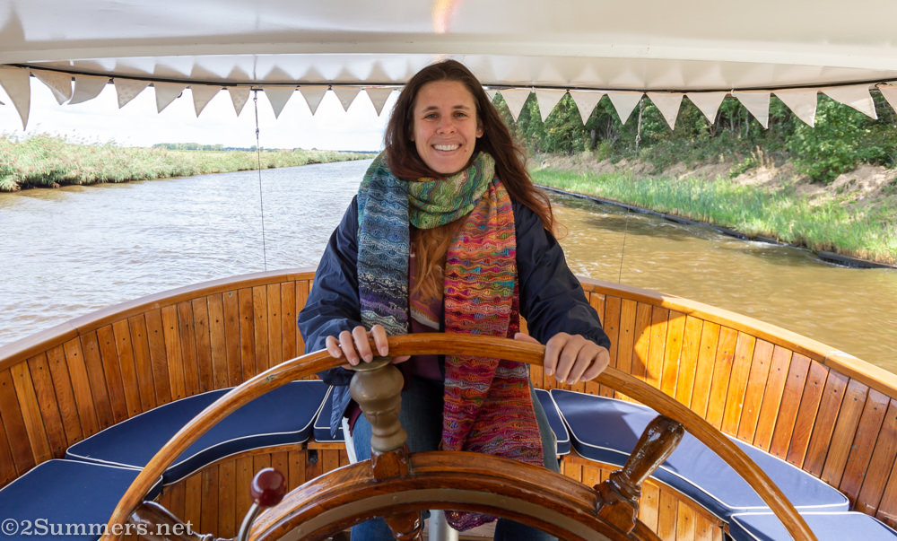 Heather driving the boat in the Netherlands