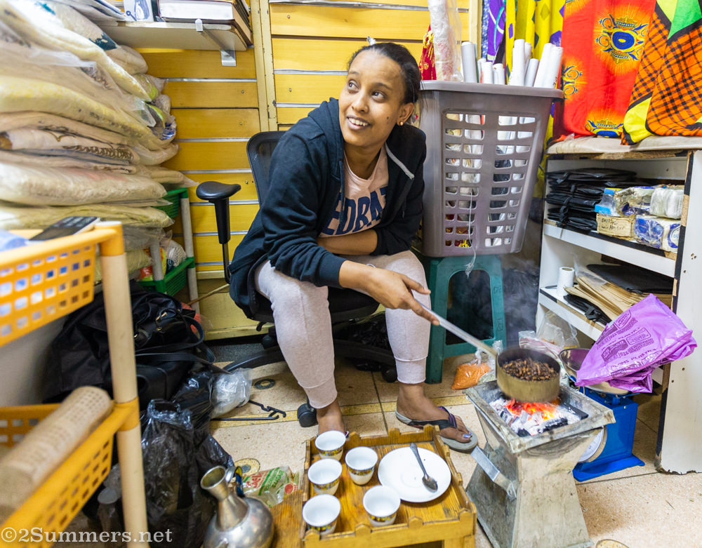 Woman making coffee in Little Addis