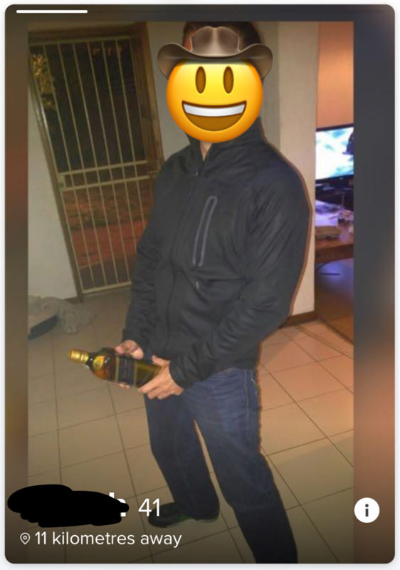Tinder profile man with whiskey bottle