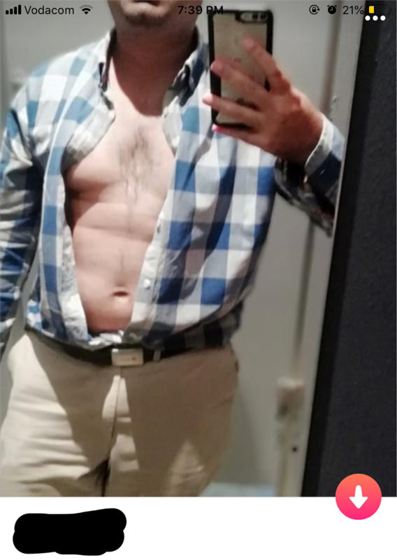 Tinder profile man with unbuttoned shirt.