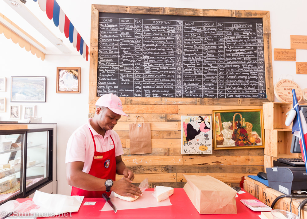 Kwanza at the cheese counter in Patisserie de Paris