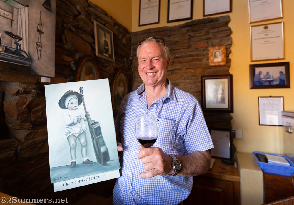 Johann with a photo of himself as a toddler