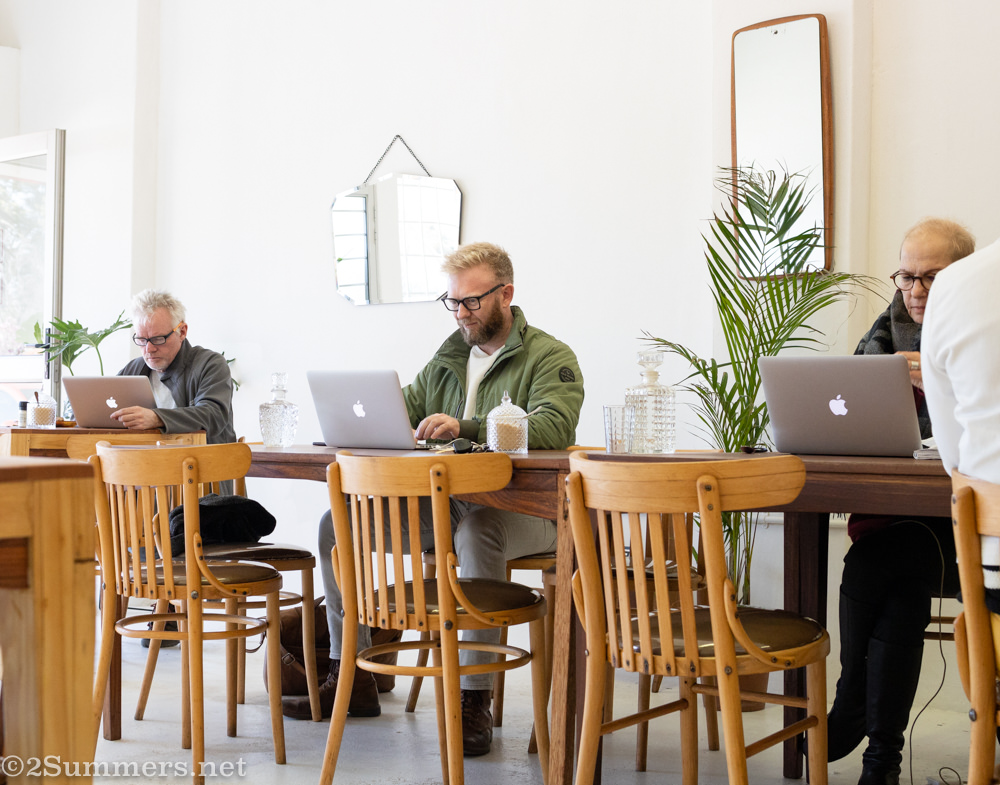 People working on MacBooks in Ophelia