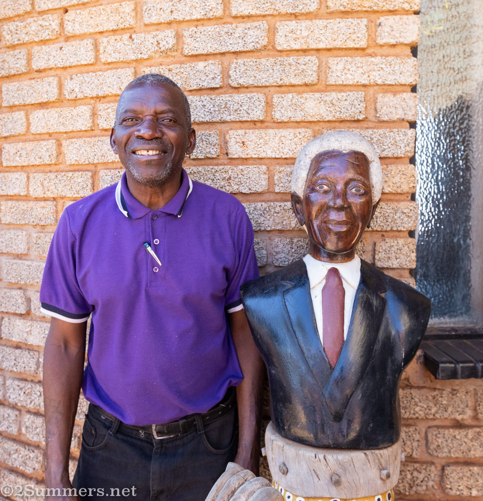 Artist Johannes Maswanganyi at his home in Msengi with one of his famous Madiba sculptures.