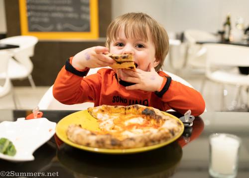Giuliano eating pizza at Bistro Dolce Vita restaurant in Morningside