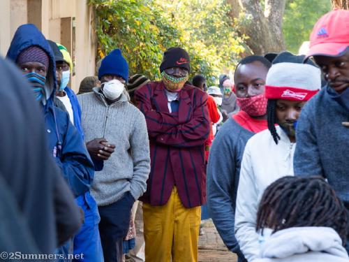 People waiting in line for food parcels
