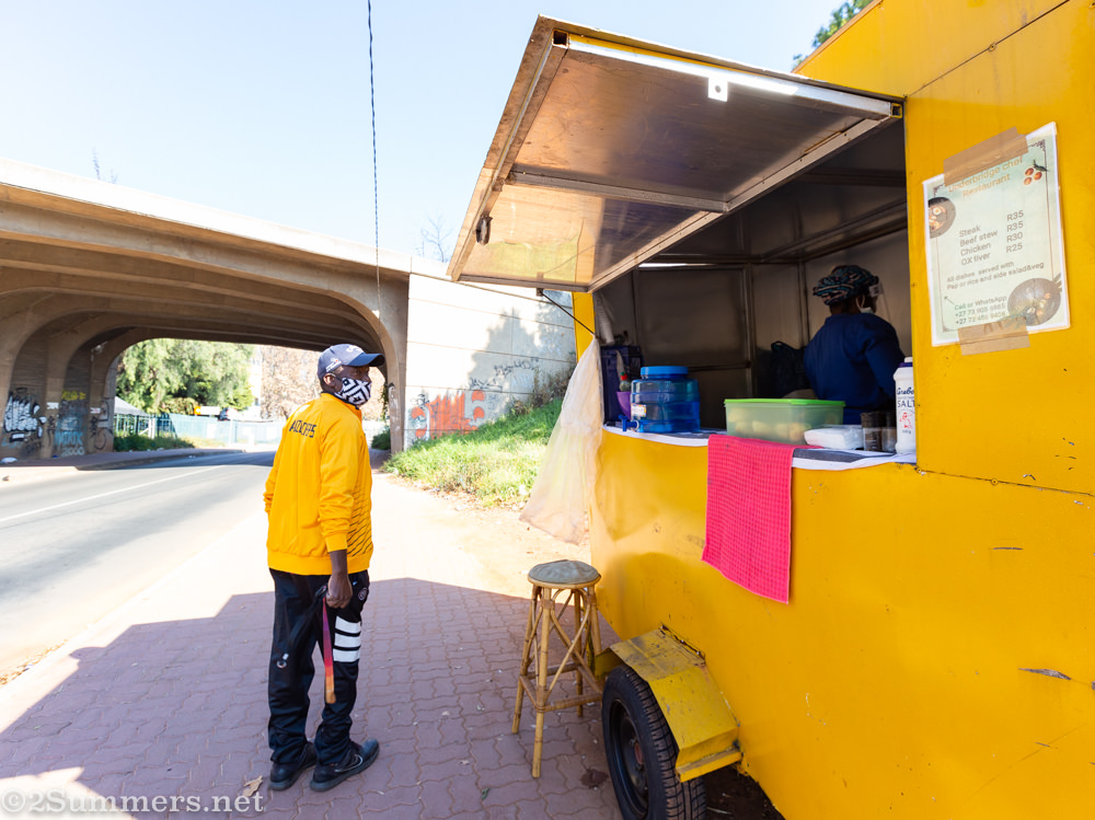 Man outside Mbali’s food trailer