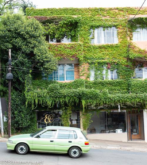 Green building and green car in Melville