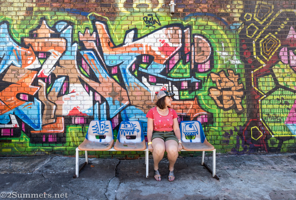 Heather in front of graffiti in Newtown