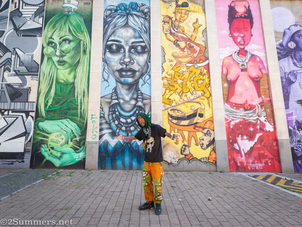 Dr. Foodz with graffiti in Newtown