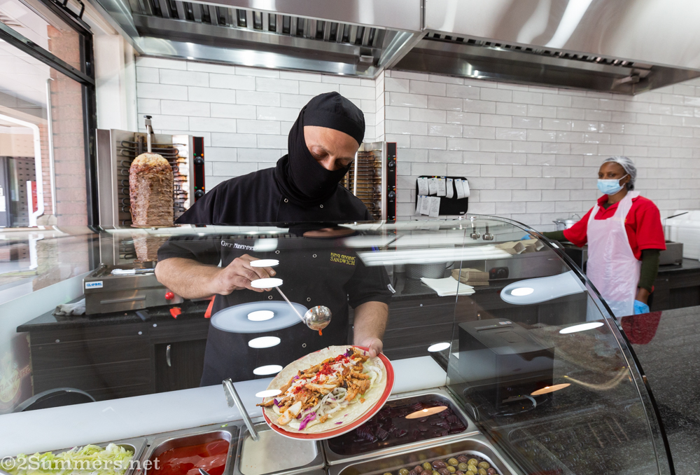 Mohammed finishes a shawarma