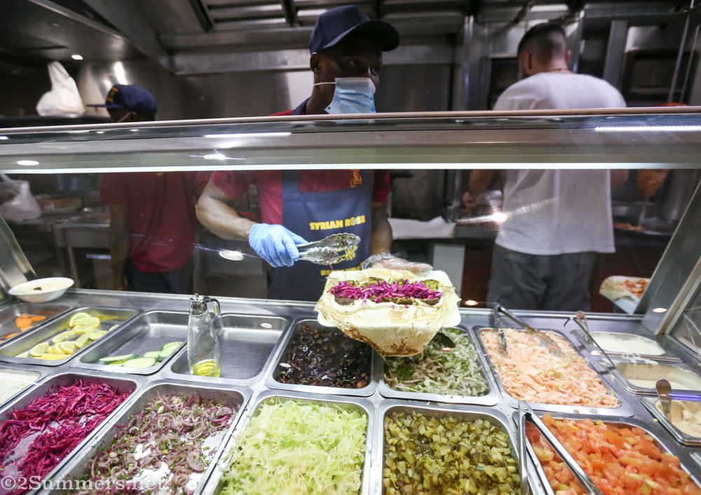 Making a falafel wrap at Syrian Rose