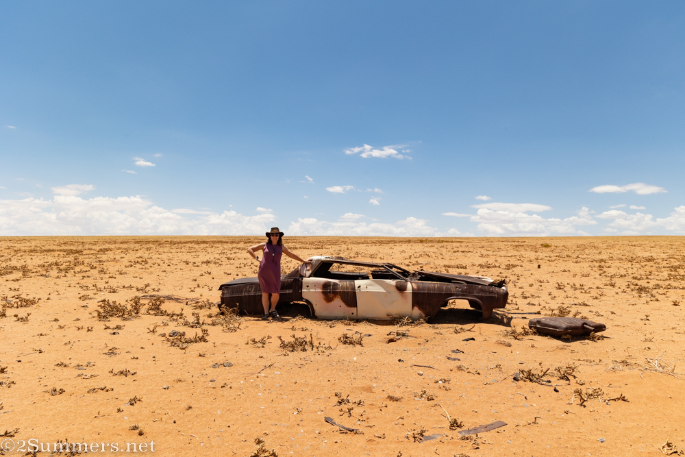 Heather by an old car on the Eureka Farm