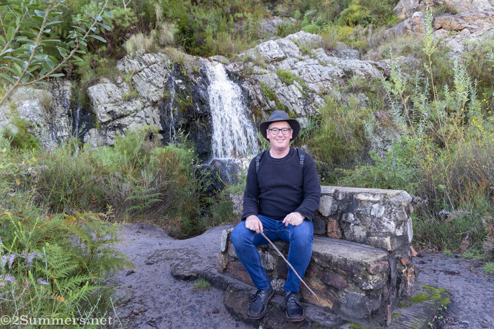 Thorsten sitting by a waterfall