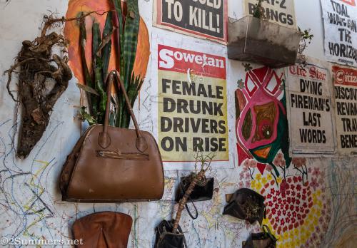 Purses and wallets hanging on the wall inside the Drill Hall