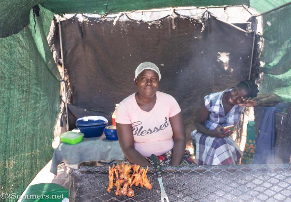 Lady selling chicken feet in Bulte