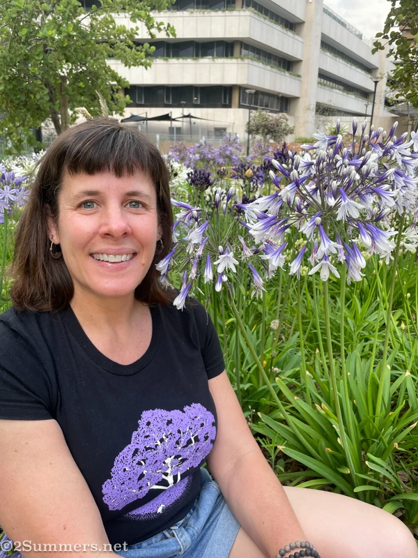 Heather sitting in the agapnathus